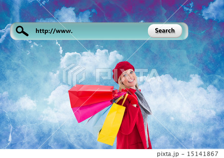 Composite image of blonde in winter clothes holding shopping bag Composite image of blonde in winter clothes holding shopping bag 15141867