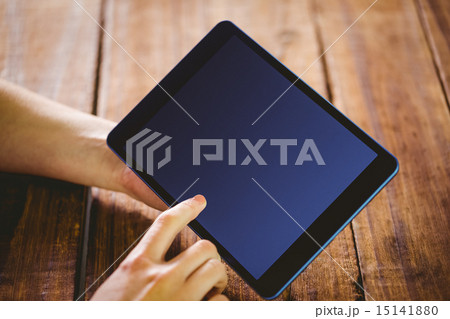 Woman using her tablet pc Woman using her tablet pc 15141880