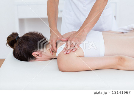 Physiotherapist doing back massage 15141967