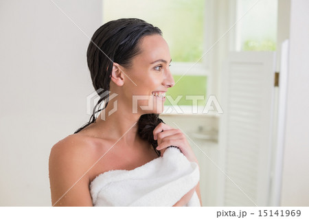 Pretty brunette wiping her hair 15141969