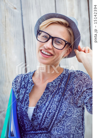 Pretty blonde woman holding folders Pretty blonde woman holding folders 15142394