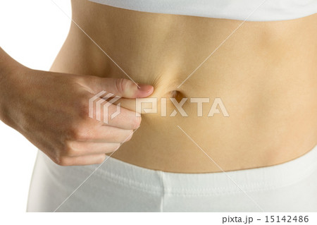 Slim woman pinching her belly Slim woman pinching her belly 15142486