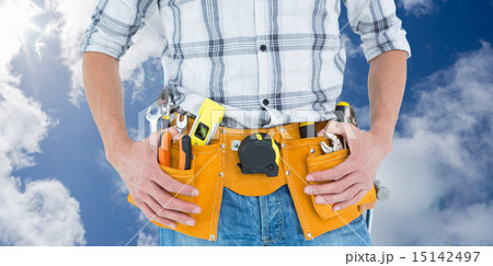 Composite image of cropped image of technician with tool belt ar 15142497