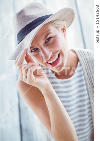Pretty blonde woman wearing hat and smiling at camera Pretty blonde woman wearing hat and smiling at camera 15143603