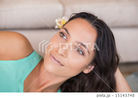 Pretty brunette lying on the floor 15143748