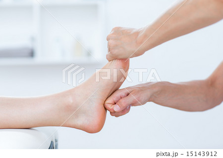 Physiotherapist doing foot massage Physiotherapist doing foot massage 15143912