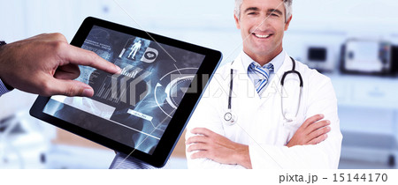 Composite image of man using tablet pc 15144170