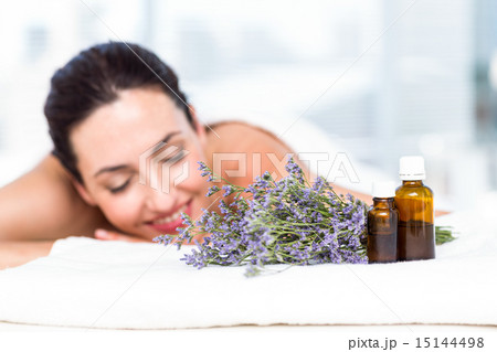 Smiling woman getting an aromatherapy treatment Smiling woman getting an aromatherapy treatment 15144498