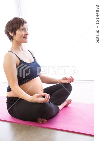 Pregnant woman keeping in shape Pregnant woman keeping in shape 15144883