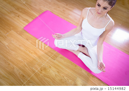 Fit woman doing yoga on mat Fit woman doing yoga on mat 15144982