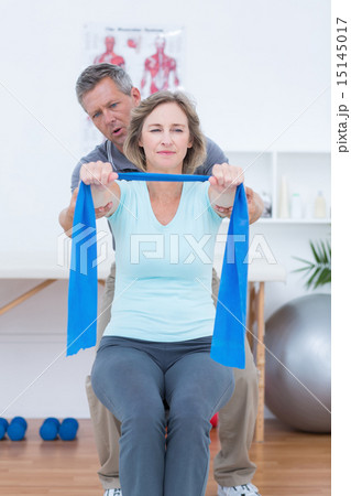 Doctor examining his patient back Doctor examining his patient back 15145017