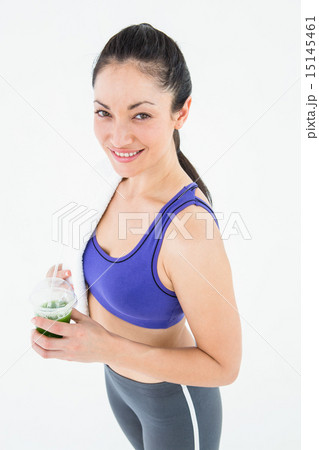 Attractive woman holding green juice Attractive woman holding green juice 15145461