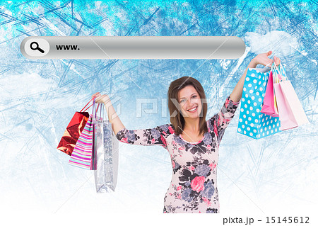 Composite image of woman standing with shopping bag Composite image of woman standing with shopping bag 15145612