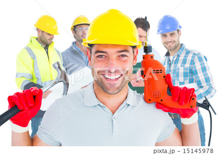 Composite image of happy repairman holding hammer and drill mach Composite image of happy repairman holding hammer and drill mach 15145978