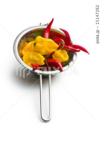 red peppers and habanero in colander red peppers and habanero in colander 15147262