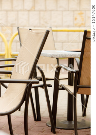 white and black restaurant chairs outdoor. Open cafe. 15147600
