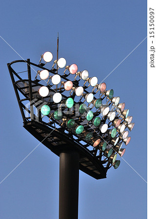 野球場の照明塔のカクテル光線の写真素材