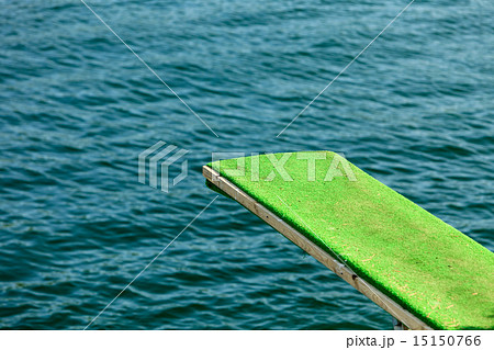 View of diving board. Springboard to dive at water. View of diving board. Springboard to dive at water. 15150766
