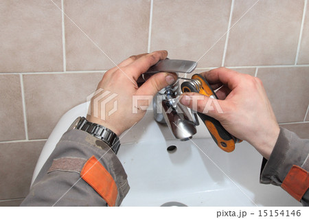 Plumber fixing water tap Plumber fixing water tap 15154146