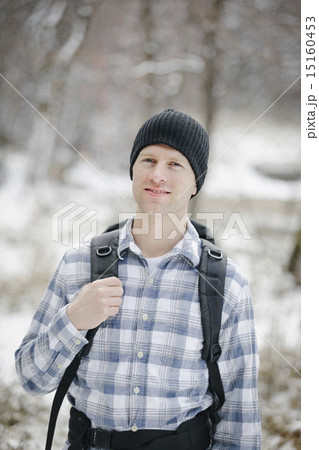 A hiker in the mountains with a rucksack and a woolly hat. A hiker in the mountains with a rucksack and a woolly hat. 15160453