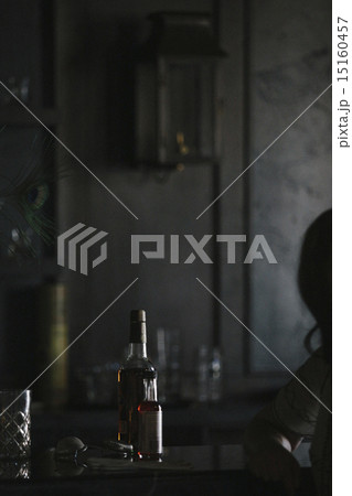 An empty table with  bottle of wine and glasses. 15160457