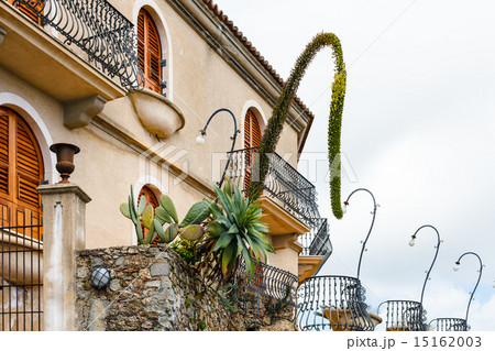 agave and Opuntia cactus in flower beds near house 15162003