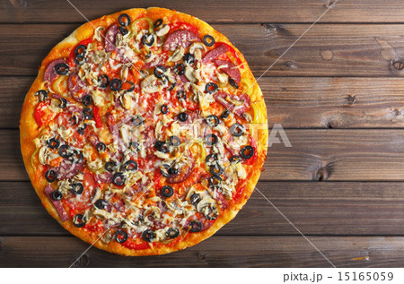 pizza on a wooden table pizza on a wooden table 15165059