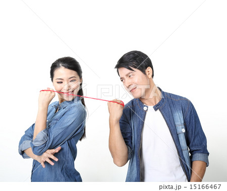 Woman pulling man by string Woman pulling man by string 15166467
