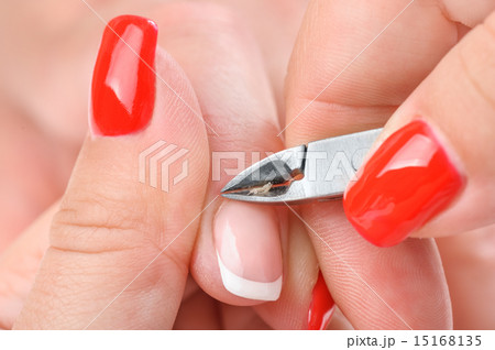 manicure applying - cutting the cuticle  15168135