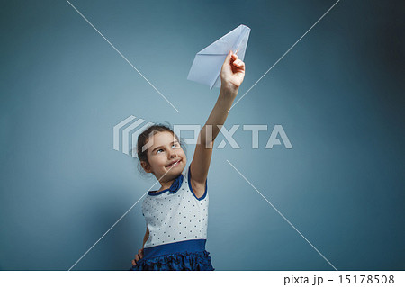 a girl of seven European appearance brunette holding a paper air a girl of seven European appearance brunette holding a paper air 15178508