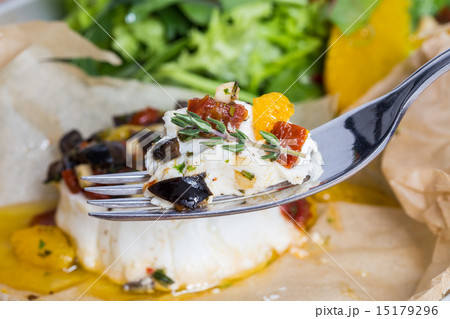 Baked goat cheese Mediterranean in parchment paper 15179296