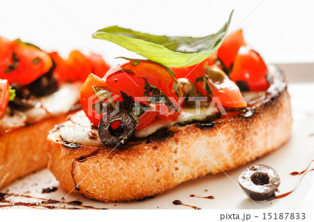 Bruschetta with tomato, mozarella and basil Bruschetta with tomato, mozarella and basil 15187833