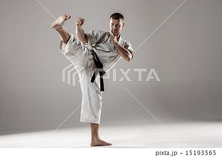 Man in white kimono training karate 15193565