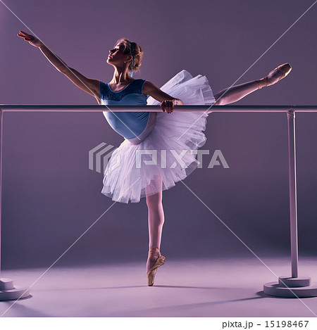 classic ballerina posing at ballet barre 15198467