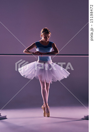 classic ballerina posing at ballet barre 15198472
