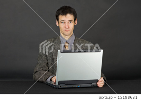 Man working with laptop computer Man working with laptop computer 15198631