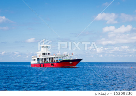Passenger ferry boat in open waters over against blue sky 15209830