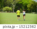 Man and girl are jogging buddy in the green park. 15212362