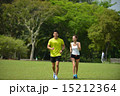 Man and girl are jogging buddy in the green park. 15212364