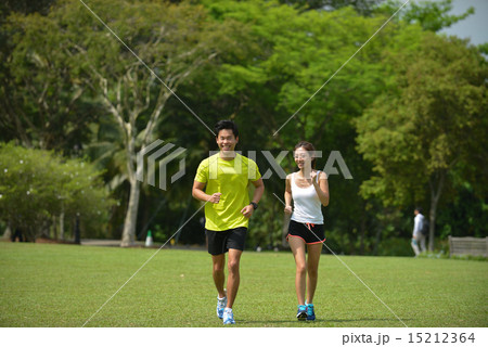Man and girl are jogging buddy in the green park. Man and girl are jogging buddy in the green park. 15212364