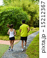 Man and girl are jogging buddy in the green park. 15212367