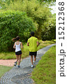 Man and girl are jogging buddy in the green park. 15212368