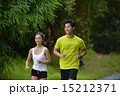 Man and girl are jogging buddy in the green park. 15212371