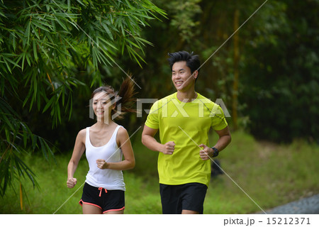 Man and girl are jogging buddy in the green park. Man and girl are jogging buddy in the green park. 15212371