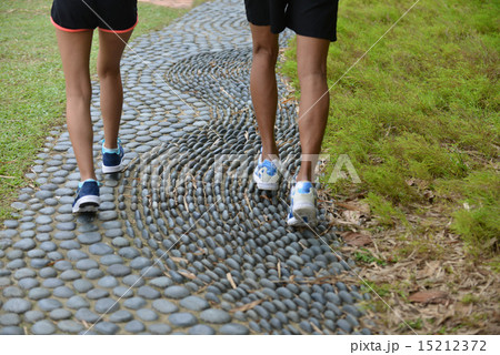 Man and girl are jogging buddy in the green park. Man and girl are jogging buddy in the green park. 15212372