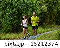 Man and girl are jogging buddy in the green park. 15212374