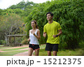 Man and girl are jogging buddy in the green park. 15212375