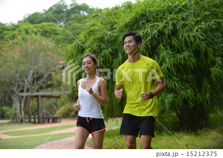 Man and girl are jogging buddy in the green park. Man and girl are jogging buddy in the green park. 15212375