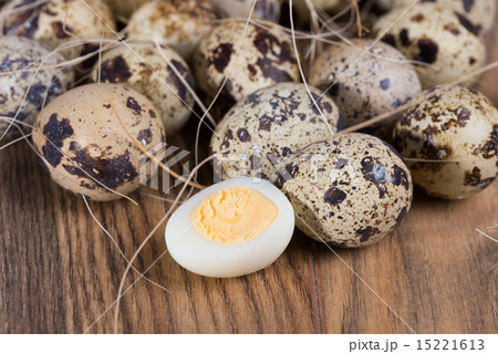 quail eggs lie in a nest on the boards 15221613
