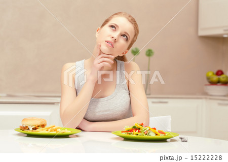 Young woman choosing lunch Young woman choosing lunch 15222228